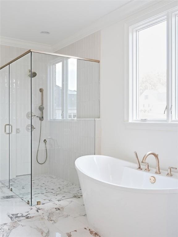 bathroom featuring crown molding and independent shower and bath