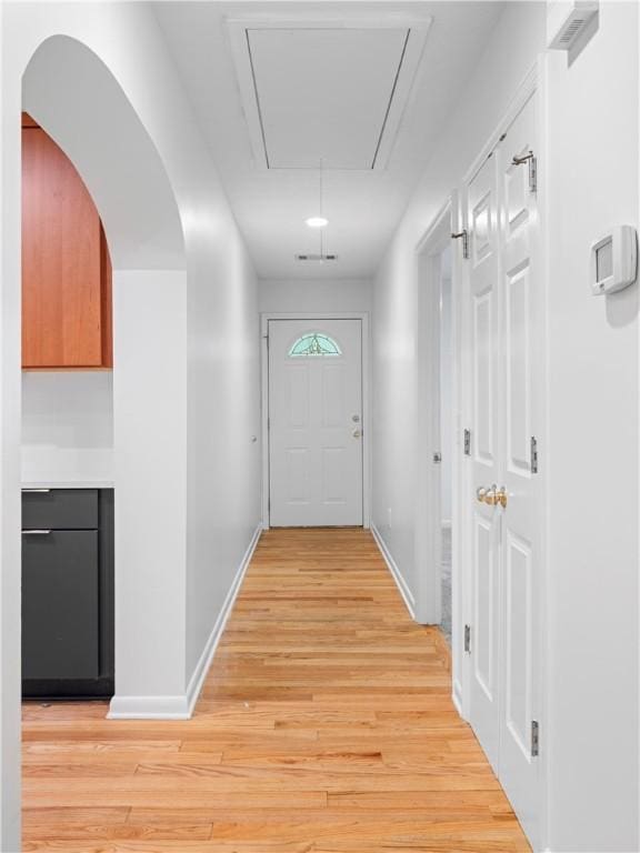 entryway with light hardwood / wood-style floors