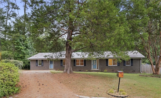 ranch-style home with a front yard