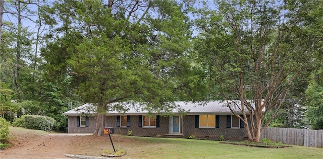 ranch-style home with a front yard