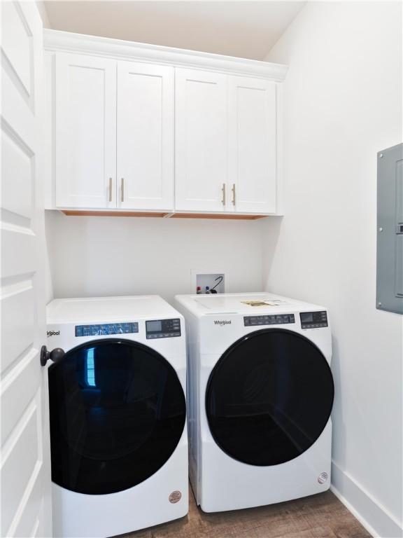 016 Crossing Ct E, Valley, AL 36854 - washroom featuring electric panel, cabinet space, washer and clothes dryer, and baseboards