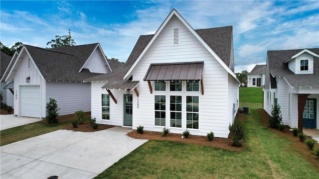 016 Crossing Ct E, Valley, AL 36854 - view of front facade with roof with shingles, a front lawn, driveway, and central air condition unit