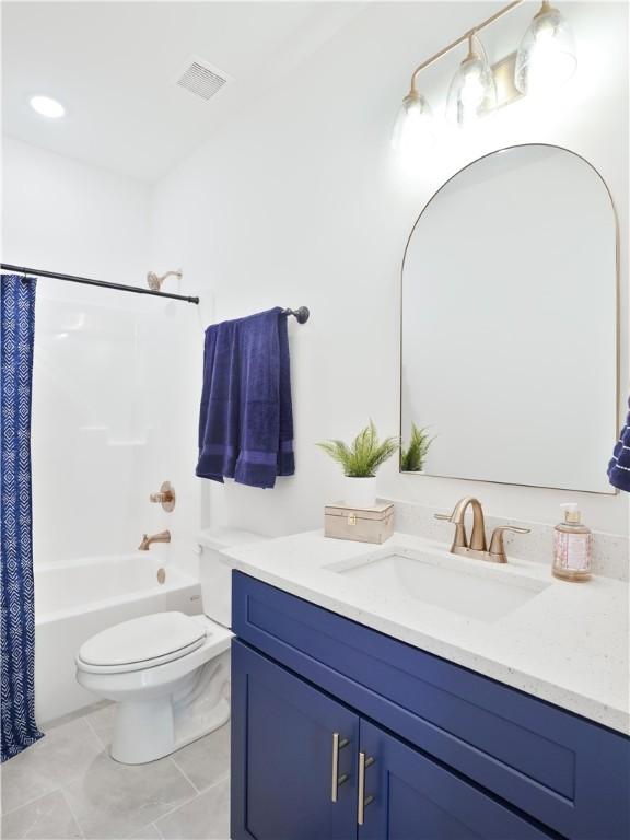 016 Crossing Ct E, Valley, AL 36854 - bathroom featuring vanity, toilet, shower / bath combination with curtain, and tile patterned floors