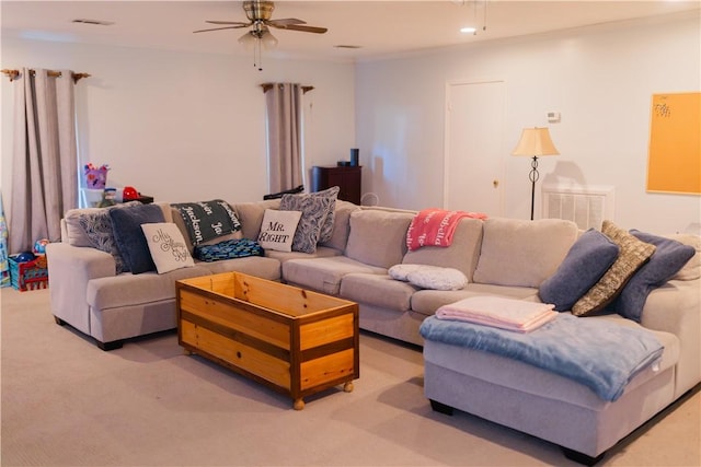 2401 11th Ave, Valley, AL 36854 - living room featuring ceiling fan and light carpet