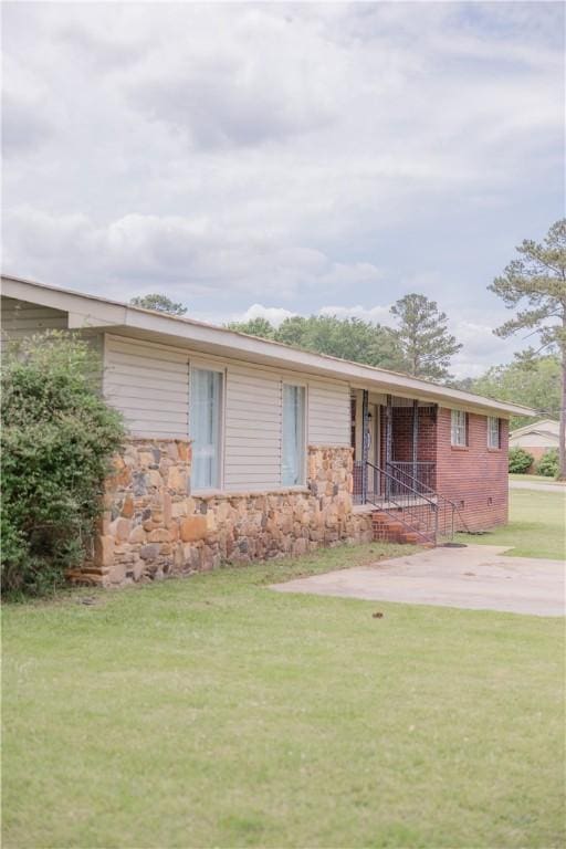 2401 11th Ave, Valley, AL 36854 - view of front of property with a front lawn and stone siding