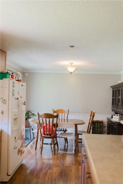 2401 11th Ave, Valley, AL 36854 - dining area featuring ornamental molding, wood finished floors, and a wainscoted wall