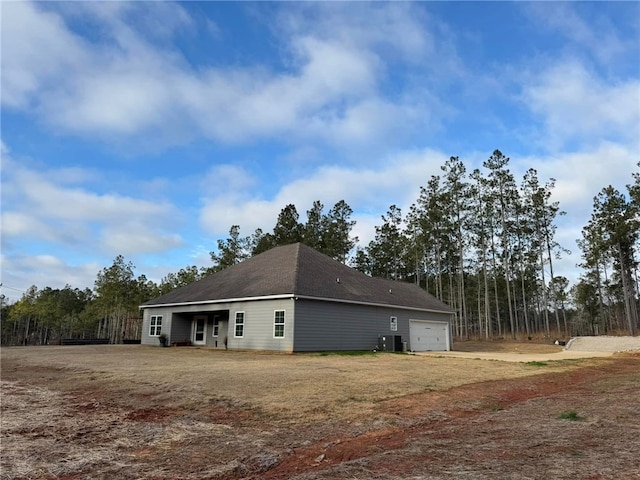 view of side of property featuring a garage