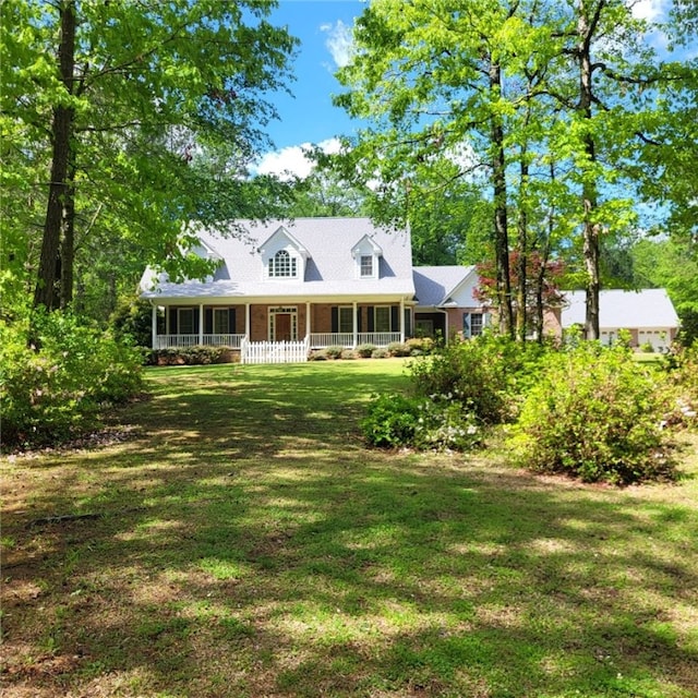 1155 County Road 517, Lanett, AL 36863 - cape cod-style house with a porch and a front lawn