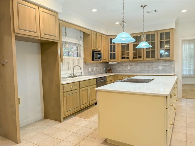 kitchen with sink, light tile patterned floors, pendant lighting, a kitchen island, and appliances with stainless steel finishes