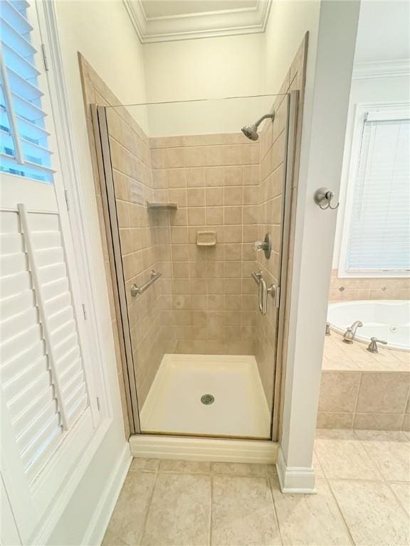 bathroom with tile patterned floors, independent shower and bath, and ornamental molding