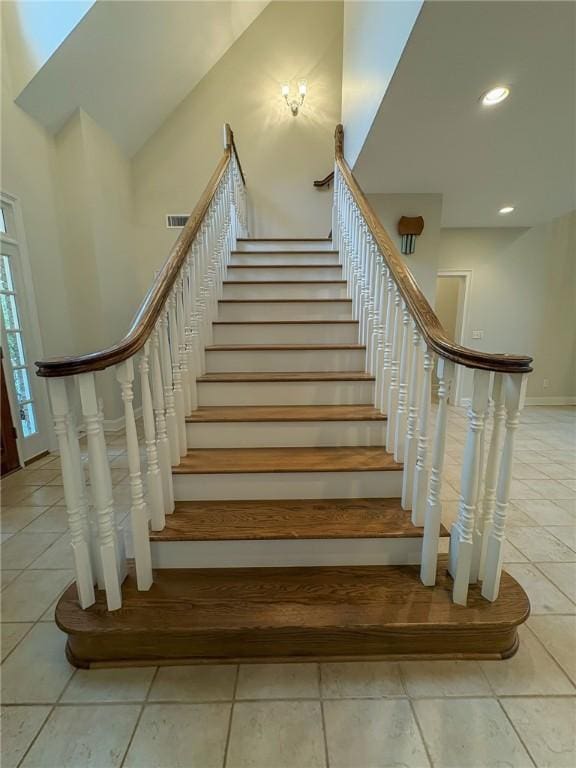 staircase with tile patterned flooring