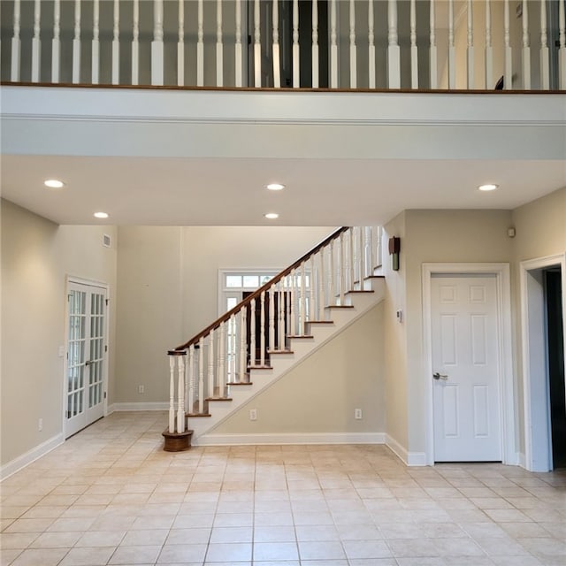 stairway featuring tile patterned floors