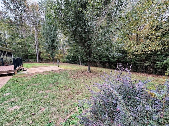 view of yard featuring a wooden deck