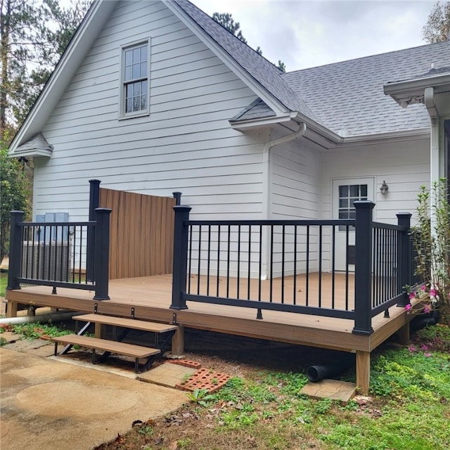 rear view of house featuring a deck