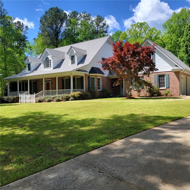 1155 County Road 517, Lanett, AL 36863 - new england style home with brick siding, a front lawn, and a porch