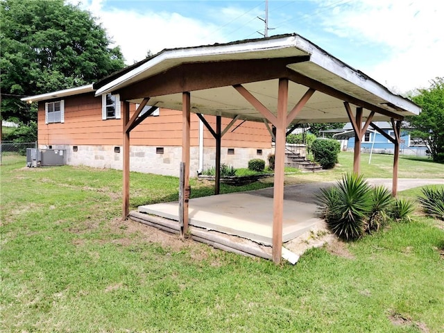 735 Willow St, Alexander City, AL 35010 - view of patio / terrace with a detached carport, central air condition unit, and fence