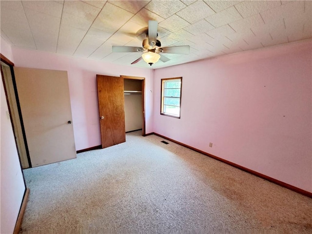 735 Willow St, Alexander City, AL 35010 - unfurnished bedroom with a ceiling fan, baseboards, carpet, and a closet