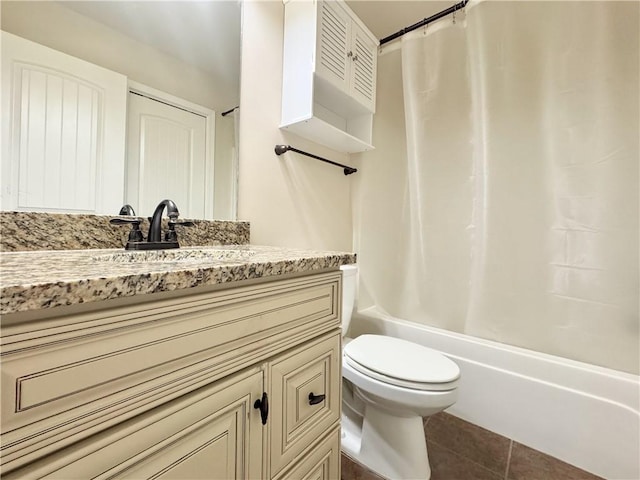 full bathroom with vanity, tile patterned floors, toilet, and shower / tub combo