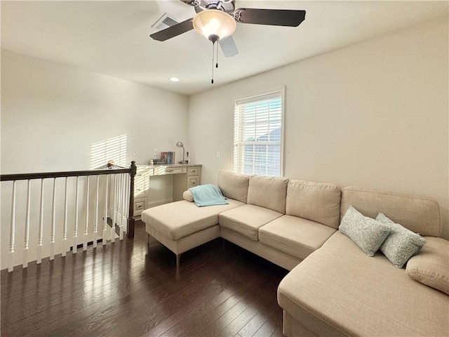 living room featuring dark wood finished floors, a ceiling fan, and recessed lighting
