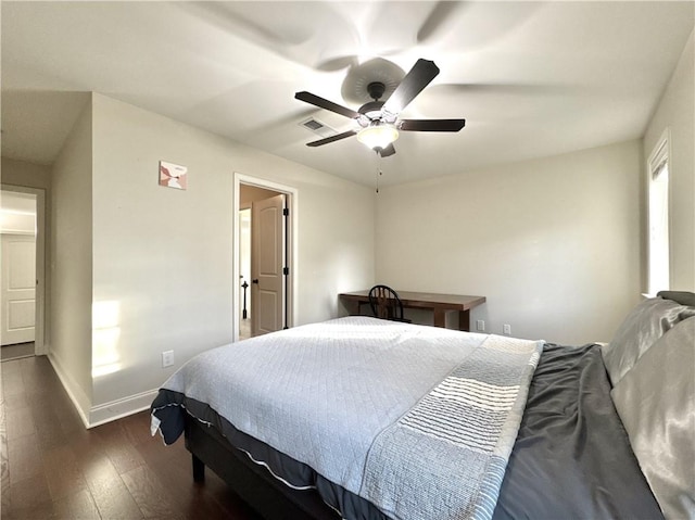 bedroom with dark wood-type flooring, baseboards, and ceiling fan