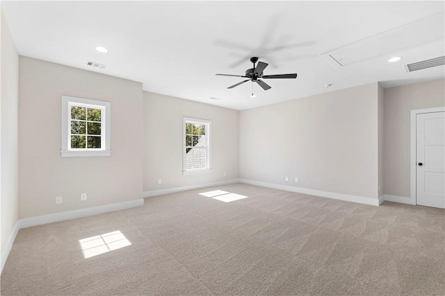 empty room with light carpet and ceiling fan