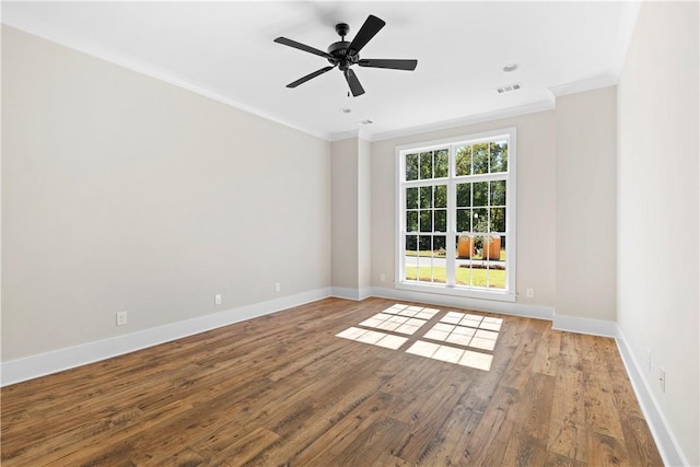 unfurnished room with hardwood / wood-style flooring, ceiling fan, and crown molding