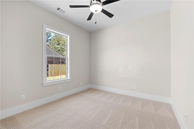 carpeted empty room with ceiling fan