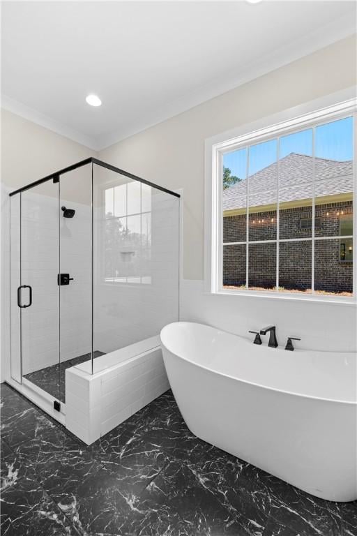 bathroom featuring crown molding and plus walk in shower