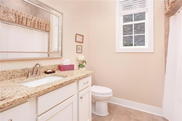 full bathroom featuring tile patterned floors, toilet, vanity, and baseboards