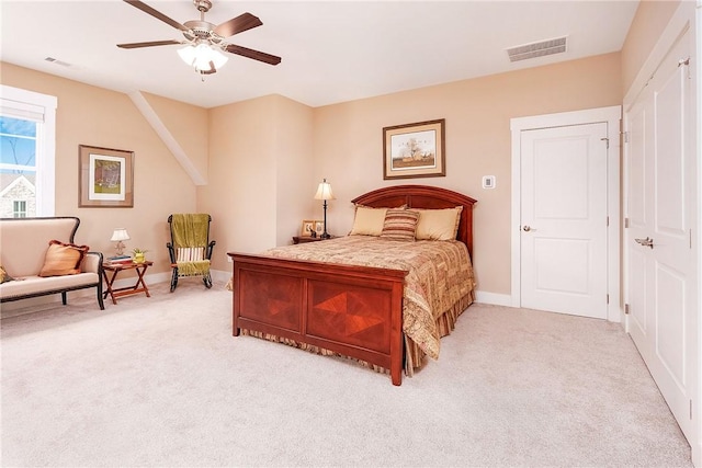 bedroom featuring visible vents, baseboards, light colored carpet, and ceiling fan