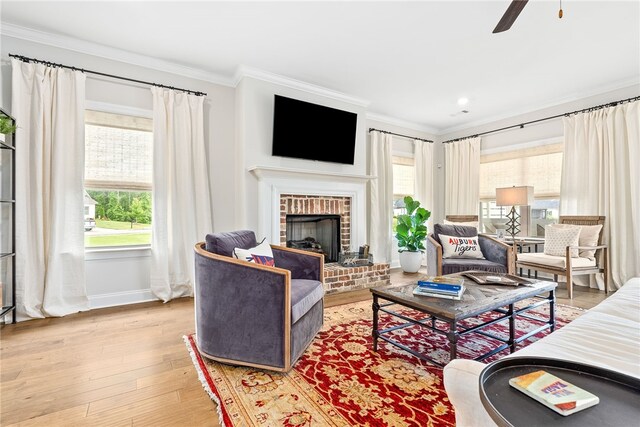 2402 Furlong Trl, Auburn, AL 36830 - living area with crown molding, light wood-type flooring, a ceiling fan, a brick fireplace, and recessed lighting