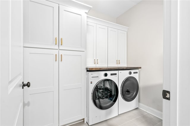 2402 Furlong Trl, Auburn, AL 36830 - laundry room with independent washer and dryer, cabinet space, and light tile patterned floors