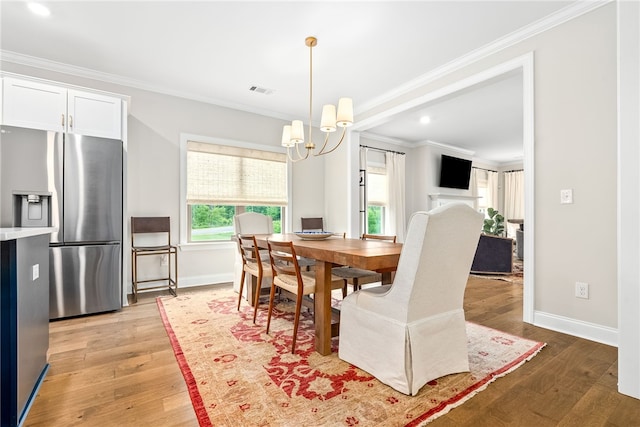 2402 Furlong Trl, Auburn, AL 36830 - dining space featuring crown molding, a chandelier, light wood-style floors, and recessed lighting