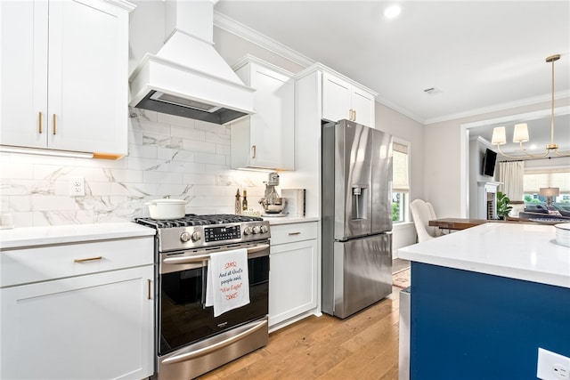 2402 Furlong Trl, Auburn, AL 36830 - kitchen with stainless steel appliances, premium range hood, light countertops, crown molding, and tasteful backsplash