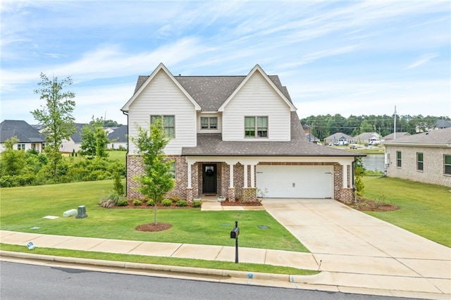 2402 Furlong Trl, Auburn, AL 36830 - view of front of home with brick siding, roof with shingles, a front yard, and concrete driveway