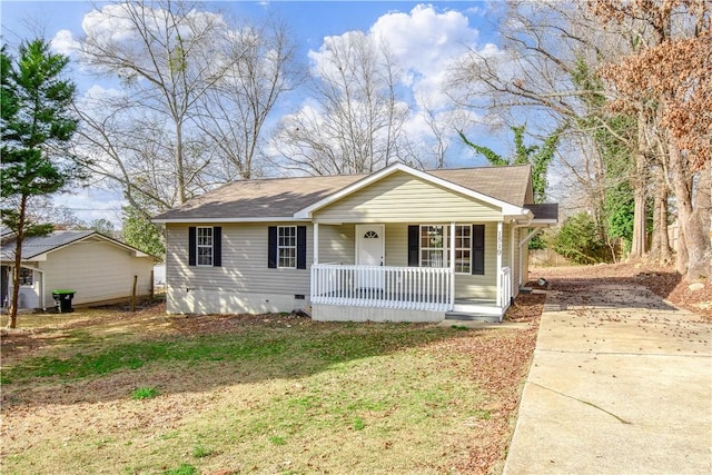 view of front of house with a front yard and a porch