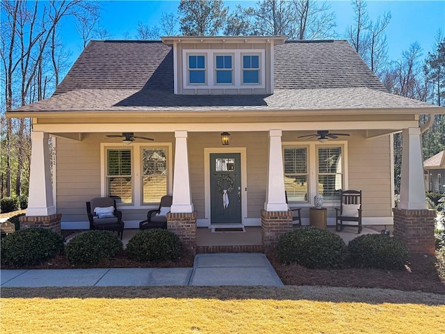 bungalow-style house featuring ceiling fan, a porch, and a shingled roof