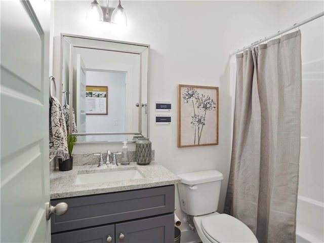 full bathroom featuring vanity, toilet, and shower / bath combo