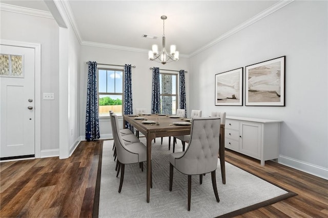 3053 Mimms Trail Rd, Auburn, AL 36832 - dining space with a chandelier, dark wood-type flooring, crown molding, and baseboards