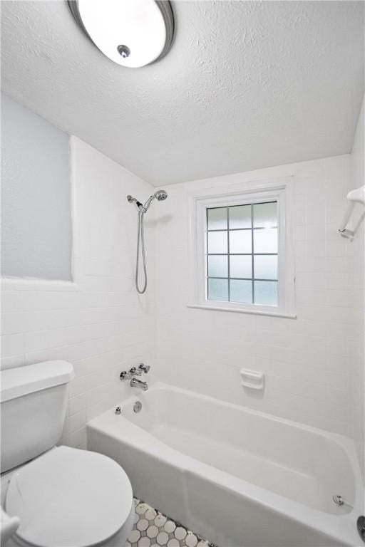 2 Lakewood Cir, Phenix City, AL 36867 - full bath with bathing tub / shower combination, a textured ceiling, and tile walls