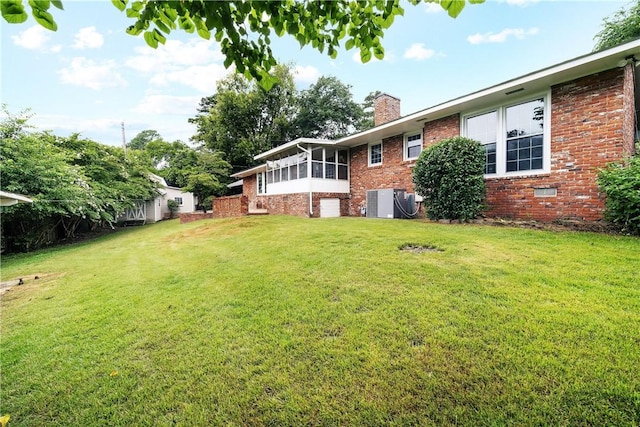 2 Lakewood Cir, Phenix City, AL 36867 - view of grassy yard with a sunroom