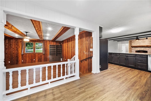 2 Lakewood Cir, Phenix City, AL 36867 - kitchen with wooden walls, light wood-style flooring, beamed ceiling, light stone countertops, and dishwashing machine