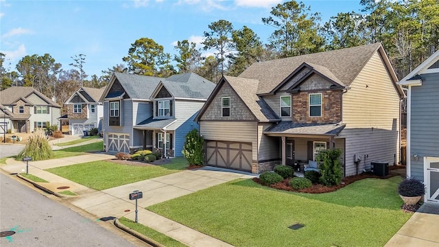 view of front of property featuring a front lawn, a garage, and cooling unit