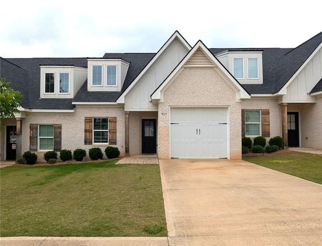 view of front of home featuring brick siding, board and batten siding, a front yard, and concrete driveway