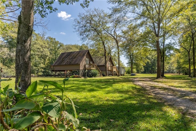 1165 Monk St, Valley, AL 36854 - view of property's community with a yard, stairway, and a wooden deck