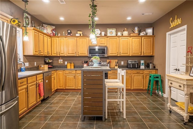 1165 Monk St, Valley, AL 36854 - kitchen with appliances with stainless steel finishes, dark tile patterned flooring, and recessed lighting