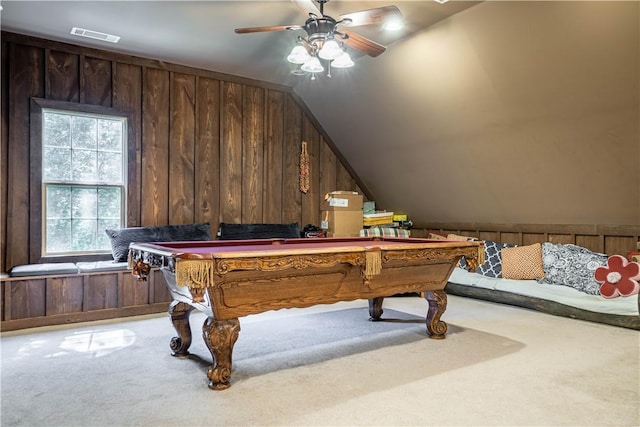 rec room with carpet flooring, ceiling fan, wooden walls, and pool table