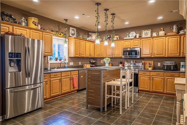 1165 Monk St, Valley, AL 36854 - kitchen with stainless steel appliances, dark tile patterned flooring, recessed lighting, and dark countertops