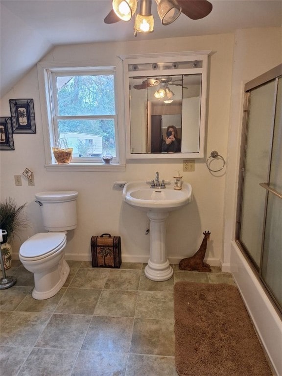 bathroom featuring shower / bath combination with glass door, toilet, and lofted ceiling