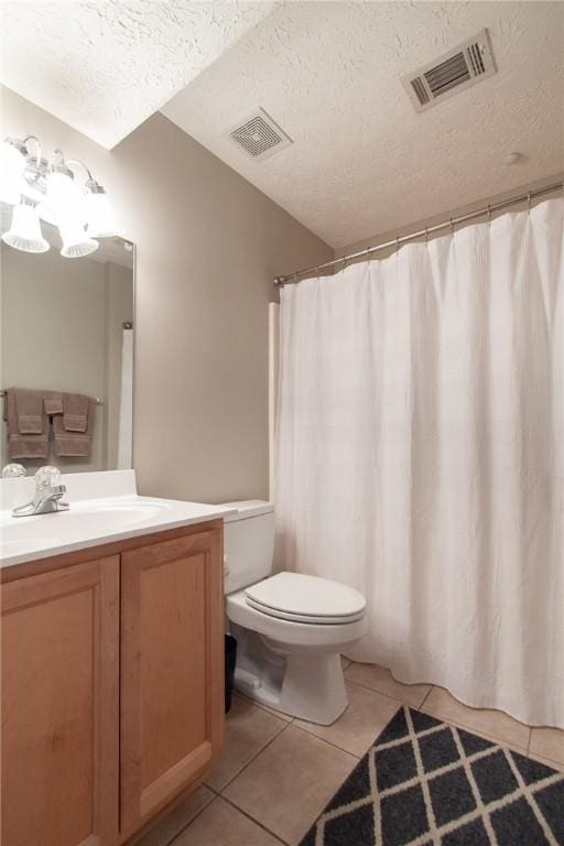 303 N Ross Ave Unit 215, Auburn, AL 36830 - full bath featuring vanity, tile patterned floors, and a textured ceiling